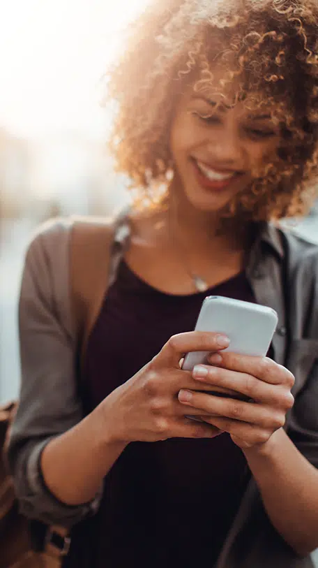 Llife Lock Case Study, Woman smiling looking at phone