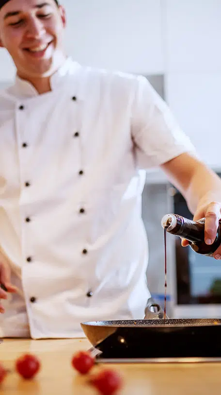 Revela Case Study, Chef pouring sauce on plate