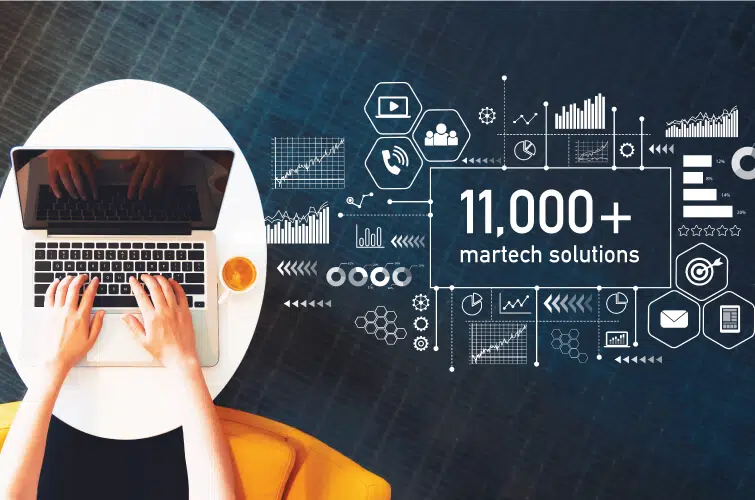 Marketing concept with person using a laptop on a white table