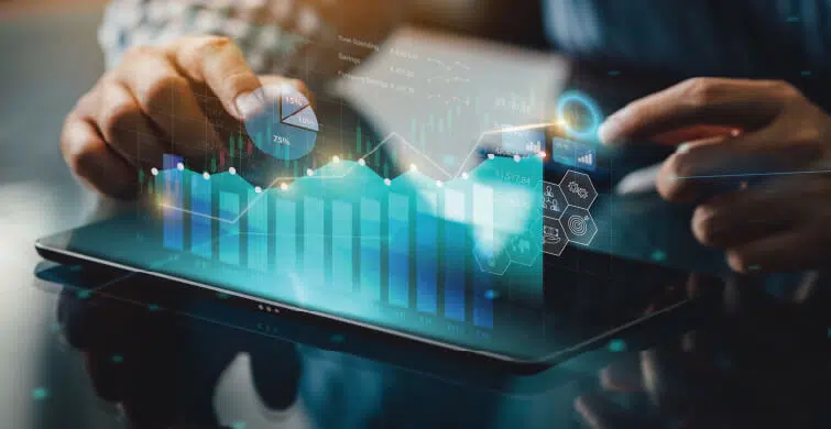 Hands reaching for floating marketing data and statistics over a smart phone.